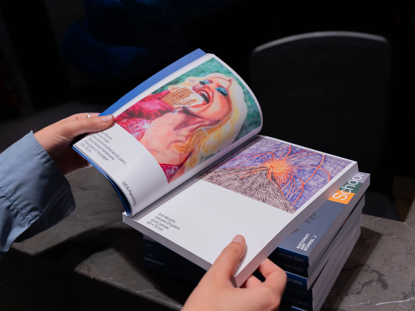 A visitor reading an exhibition publication